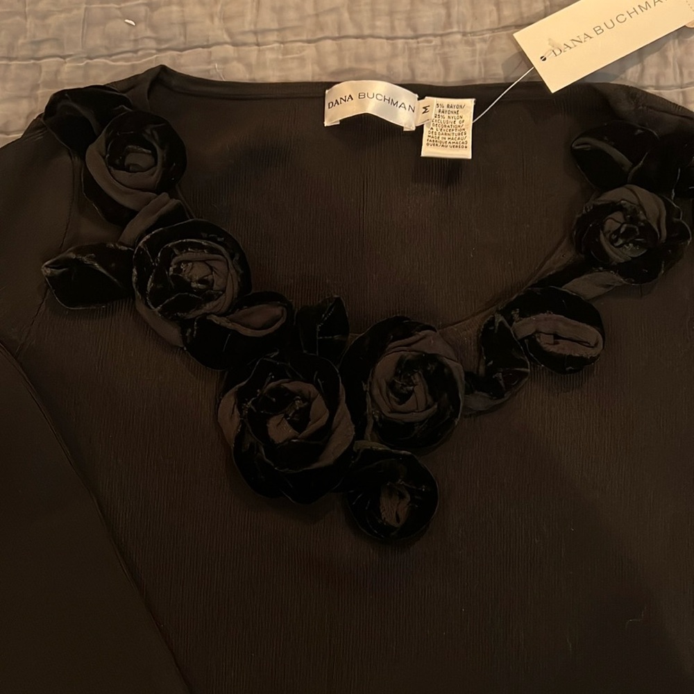 Ladies top with rosebuds around the neck